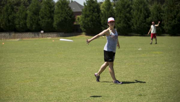 Liz Craig, HUSL member, flicks a pass at a pickup ultimate frisbee game in Madison. (Jen Fouts-Detulleo)