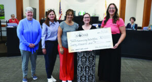 MCDAB presents check to Parks and Recreation, chairperson steps down