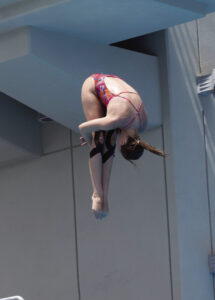 Lone James Clemens’ diver flips and twists toward her goal for diving championship