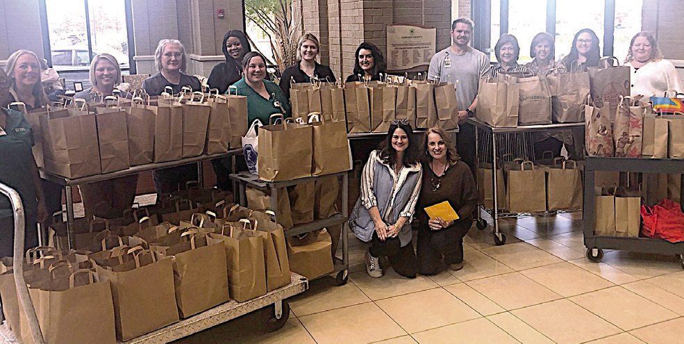 Madison Hospital employees donate 111 sacks of groceries to Bags of Blessings
