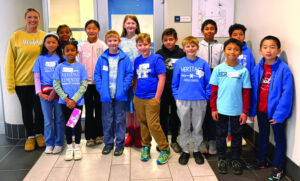 Math Coach Briana Tanner help students to explore math concepts