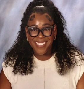 Math Coach Briana Tanner help students to explore math concepts