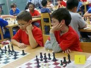 Michael and Mitch consider their next move at a 2012 chess match. (CONTRIBUTED/RANAE BARTLETT)
