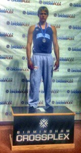 Preston Johnson stands on the winner's pedestal at the Martin Luther King Indoor Track Classic at the CrossPlex Athletic Facility in Birmingham. (CONTRIBUTED) 