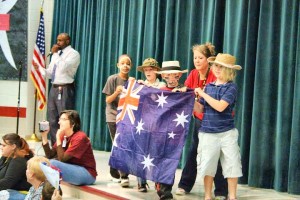 Horizon Principal Rodney Richardson, at left, announces the parade of countries. (PHOTO / ASHLEY HODGES) 