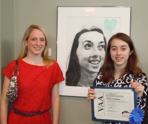Olivia Goldston, at right, stands by her self-portrait, "The Geek" with art teacher Jennifer Norton. (CONTRIBUTED) 