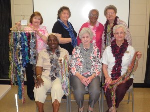 Madison Senior Center members modeling and presenting scarves for the Spring Arts & Craft Fair are, seated from left, Lucille Miller, Velma Herd and Joy Edwards, back from left, Norma Collum, Sheila Harris, Anna Gay and Elsie Hendrix. 
