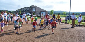 A boy sprints to the lead at the 2012 Helen P. Lee Memorial Fun Run at Madison Public Library. (CONTRIBUTED) 