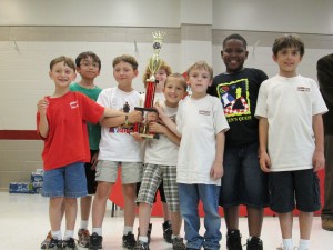 Horizon's chess team enthusiastically accepted the trophy for the primary division at Queen's Quest. (CONTRIBUTED)