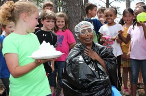 West Madison Principal Dr. Daphne Jah appears frightened as top reader Katie Grace Jones prepares to throw a pie. (CONTRIBUTED)