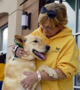 Volunteer Josie Cooper hugs a dog that MARF has had for adoption. (CONTRIBUTED) 
