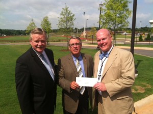 Earlier this year, Rep. Mac McCutcheon, center, presented a check for $10,000 to Dr. Brian Clayton, at right, principal at James Clemens High School and Madison City Schools Superintendent Dr. Dee Fowler. (CONTRIBUTED) 