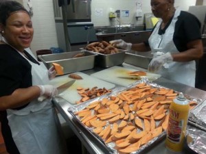 Cafeteria employees at Liberty Middle School prepare sweet potatoes from Cullman. (CONTRIBUTED)