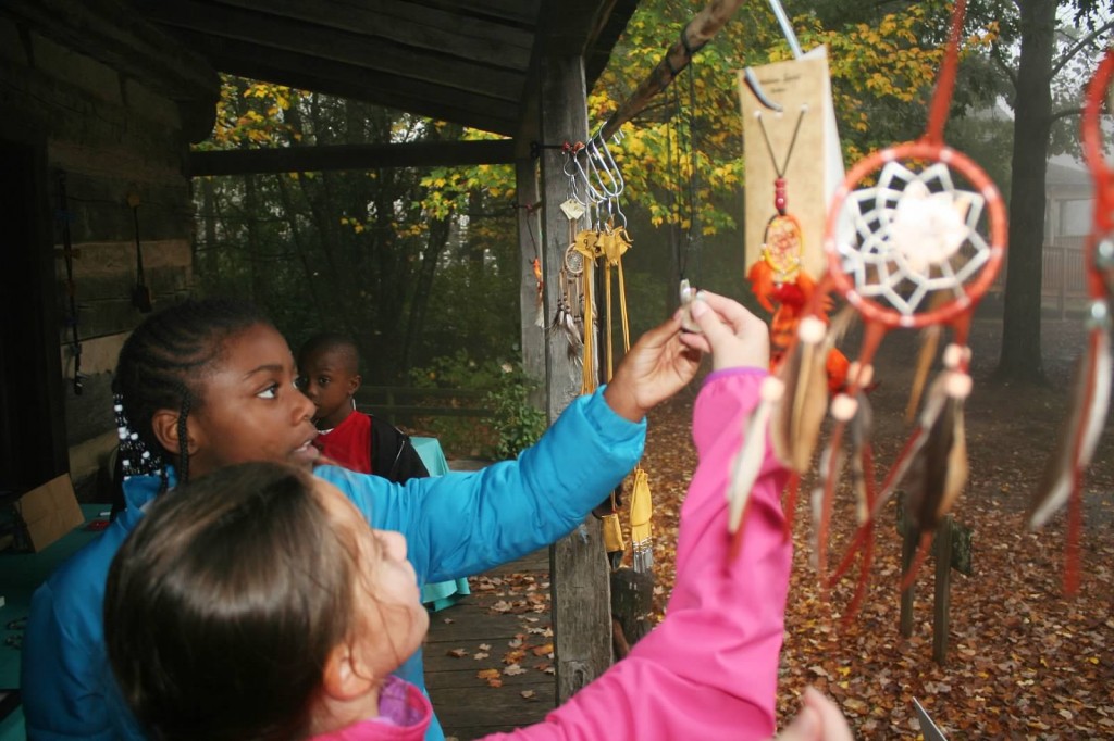 Columbia fourth-graders Emma Parmenter and Princess Howard check out dream catchers at Burritt on the Mountain. (CONTRIBUTED) 