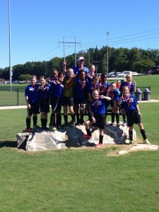 The North Alabama United Stars soccer team pauses with their trophy after the Battle at the Jack Tournament. (CONTRIBUTED) 