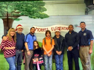 Sponsor Anthony Graham, third from left, coordinated RUFF's work with students and teachers at Morris Elementary School. (CONTRIBUTED) 