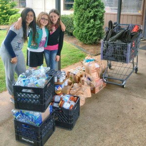 Girls Scouts Ella Burch, Trinity Christian and Hannah Schricker earned the Bronze Award by collecting food and supplies for the Downtown Rescue Mission. (CONTRIBUTED) 