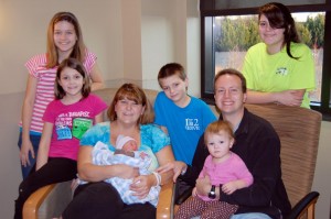 Members of the Long family are Lexi, from left, Alivia, mother Anna with infant Reece, Robbie, father Andy with 18-month-old Ava and Abbi. (CONTRIBUTED)