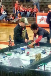 Members of the Firestorm team from Heritage position their robot for the next round at the Alabama State FIRST LEGO League (FLL) Tournament. (CONTRIBUTED) 