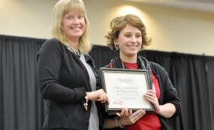 Riley Wallace, at right, receives the Bailey Cason Editorial Writer of the Year award from Meredith Cummings, Alabama Scholastic Press Association director. Wallace also was named Alabama High School Journalist of the Year. (CONTRIBUTED) 
