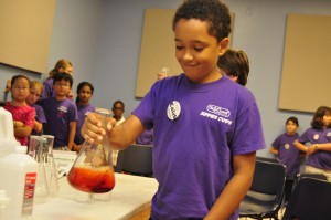 A Sci-Quest camper performs a chemistry experiment. (CONTRIBUTED) 