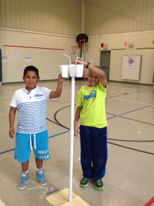 STEM Club members Caleb Velazquez-Soto, at left, and Ashton Bradley-Miland demonstrate their "Stop, Drop, Don't Pop" model at Madison Elementary School. (CONTRIBUTED) 