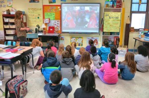 Leah Igo (standing) watches "The Morning Show" with her third-grade students at Columbia Elementary School. (CONTRIBUTED) 