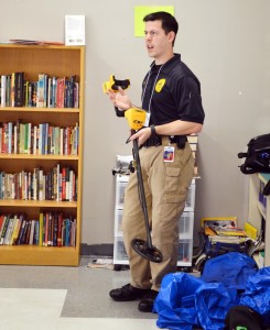 During Career Day at Liberty Middle School, Ted Thiele demonstrated a metal detector, which he sometimes uses in his job as a crime scene investigator in Madison. (CONTRIBUTED) 
