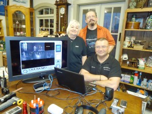 Kevin Thompson, who is seated, Molly Spence and Scott Peterson led a paranormal investigation at Madison Station Antiques. They are members of the Madison County Paranormal Research Society. (RECORD PHOTO/GREGG PARKER) 