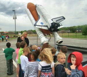 Horizon students inspect a scaled model of the space shuttle that visited campus during Space Week. (CONTRIBUTED) 