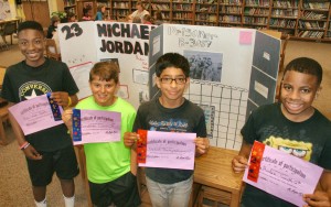 Aremon, Jonathan, Ankit and DeAndre proudly show their ribbons and certificates for book entries in the West Madison Reading Fair. (CONTRIBUTED) 