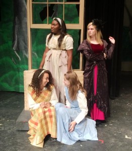 Devyn Guilleabeaux, standing left, as Ash Girl gets a leer from the Stepmother, portrayed by Lindsey Solomon, in "The Ash Girl" at Bob Jones High School. The naughty stepsisters are Kayla Thompson, seated from left, and Caroline Jackson. (CONTRIBUTED) 