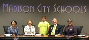 West Madison fifth-grader Jake Gaertner, center, caught the attention of school board members Ranae Bartlett, from left, Dr. Terri Johnson, superintendent Dr. Dee Fowler and Connie Spears. (CONTRIBUTED) 