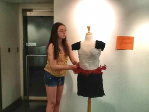 James Clemens student Lauren Garrett was a finalist in the Rising Design Star Challenge, sponsored by Birmingham Museum of Art. Lauren is shown adjusting the dress at the museum. (CONTRIBUTED) 