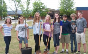 SADD (Students Against Destructive Decisions) planted a cherry tree for Arbor Day at Discovery Middle School. These SADD members are Dayle Rumley, from left, Taylor Lewis, Faith Osborn, Christina Bolton, Lindsay Diggs, Francisco Miranda, Nathan Siwko and Luke Cheatham. (CONTRIBUTED) 