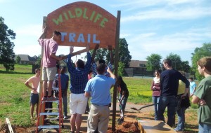 Members of the Jet Wildlife Team install a sign at the wildlife area at James Clemens High School. (CONTRIBUTED) 