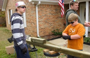 Spencer Shafer, at left, precuts wood to make benches for his project to earn the Eagle Scout rank. (CONTRIBUTED) 