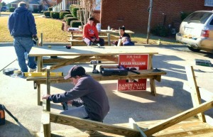 To earn the Eagle Scout rank, Zach Nash, at back in red sweater, supervised a work crew to build picnic benches for Liberty Middle School. (CONTRIBUTED) 