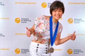 Sabrina Chen signals 'thumbs-up' approval after receiving her national medal at the Scholastic Arts & Writing Awards' ceremony at Carnegie Hall in New York City. (CONTRIBUTED) 