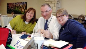 Dr. Jim Knight talks with Alyson Carpenter, at left, and Dr. Melissa Coman at an instructional coaching seminar at the University of Kansas. (CONTRIBUTED) 