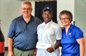 Shelton L. Torbert Jr., center, scholarship recipient with the Rocket City Tailgate Challenge, is congratulated by Lite 96.9 radio personalities John Malone and Bonny O'Brien. (CONTRIBUTED) 