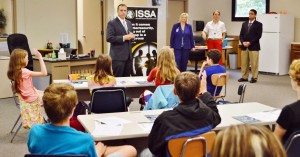 Ben McGee, standing at center, fields a question from a student at the Cyber Security Club meeting at Discovery Middle School. McGee works as chief scientist with Aleta Technologies. (CONTRIBUTED) 