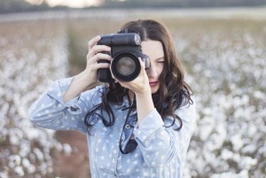 Jen Fouts-Detulleo with JFD Photography & Design stands in a field of ready-to-pick cotton. (CONTRIBUTED)