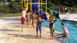At Hogan Family YMCA, aquatics instructor Alan Kent works with students from Triana. The children are learning to swim with funding from the John Stallworth Foundation. (CONTRIBUTED) 