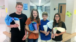 Liberty Middle School students Jared Kolowski, from left, Delaney Horton, Battle Clayton and Lily Wright show the Schultuten (gift cones) that they received from German students at James Clemens High School. (CONTRIBUTED) 