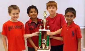 Members of the award-winning Columbia Elementary School Chess Team are Chase Smith, from left, Pranaav Satheesh, Aaron Woods and Abhi Emani. Their coach is Russ Freeman. (CONTRIBUTED) 