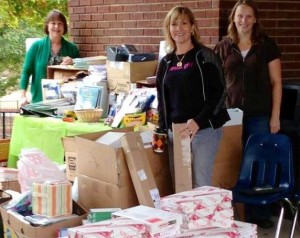 Huntsville 'First Lady' Eula Battle, from left, Madison 'First Lady' Dana Trulock and Susie Averitt work at a classroom supply drive for Free2Teach. (CONTRIBUTED) 