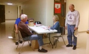 The 2014 Triana Health Fair, hosted by CASA, will be held at St. Paul-Triana United Methodist Church on Oct. 7 from 9 a.m. to noon. In this photo, CASA volunteers register visitors at an earlier fair. (CONTRIBUTED) 