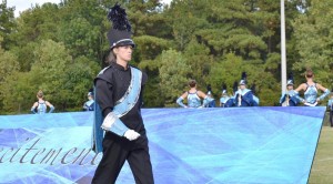 Katie Miller, who won "Best in Class" Drum Major, strides to the podium to lead the James Clemens High School Band in competition at the Dixie Pride Marching Classic in Trinity. (CONTRIBUTED) 