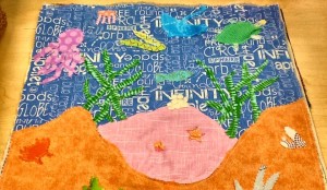 Students used an under-the-sea design for this quilt block with an octopus, oyster with a pearl, a manta ray and sea turtle. (CONTRIBUTED) 